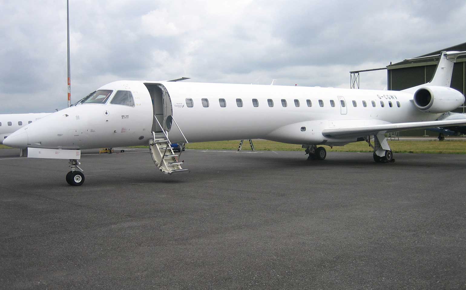 Embraer 145 Jet private aircraft charter at FBO terminal parked