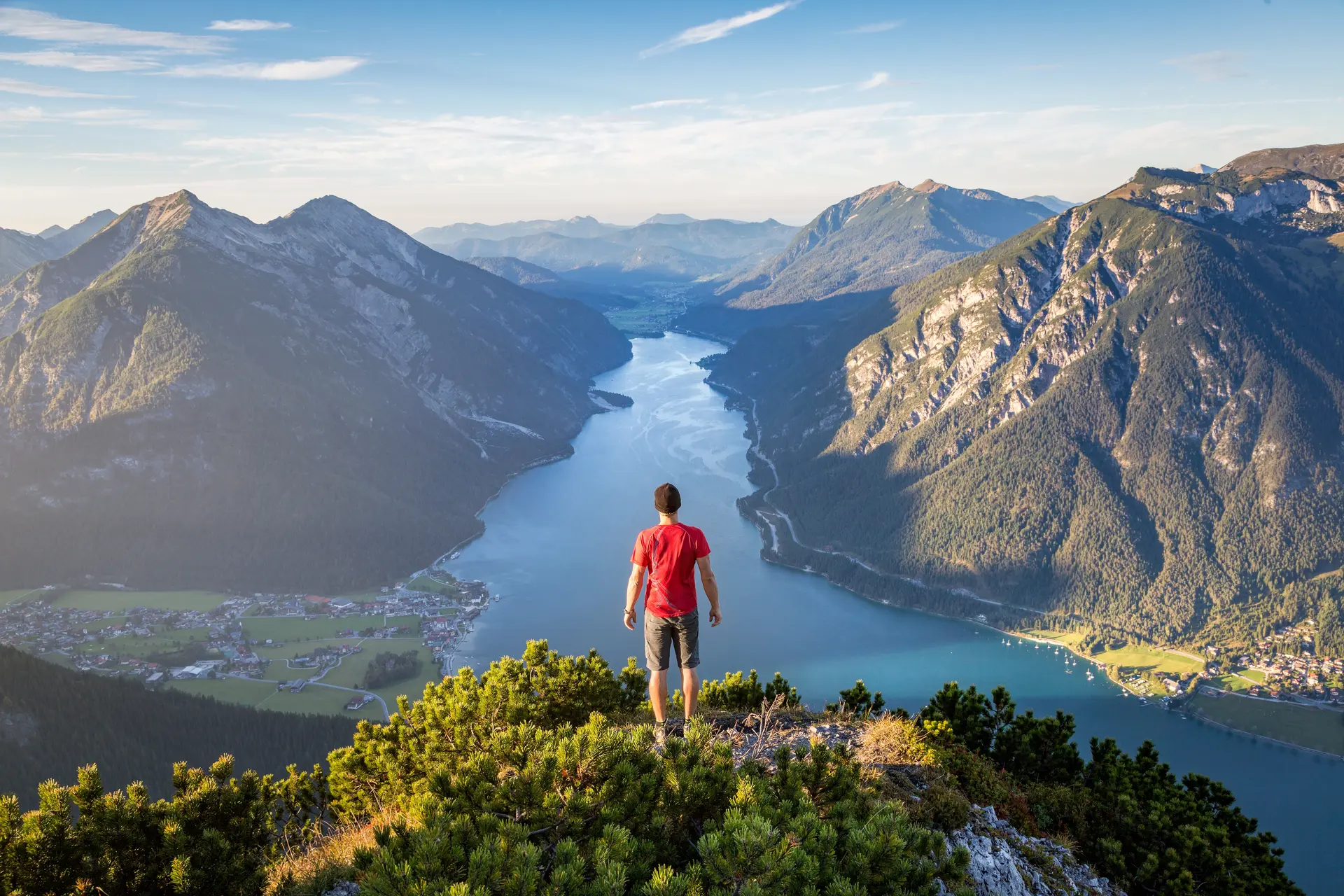 Mountaineer enjoying the view over lake Achensee