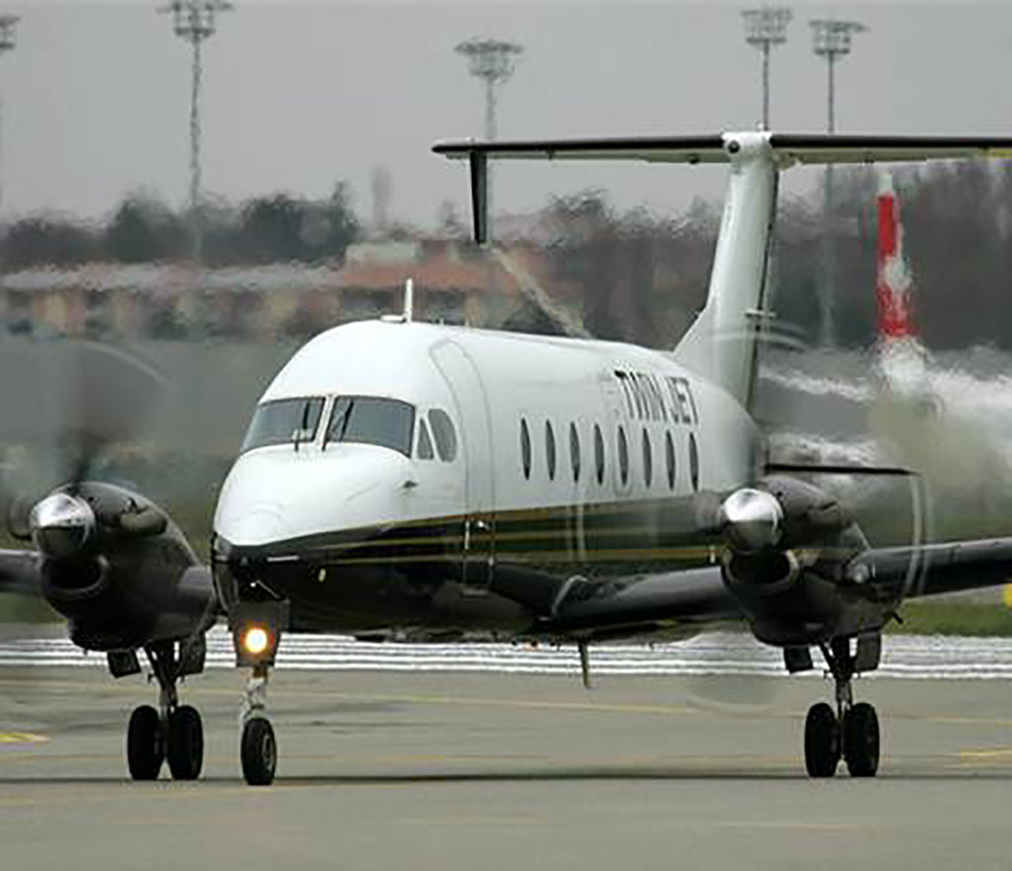 Beech 1900 cargo charter aircraft preparing for takeoff