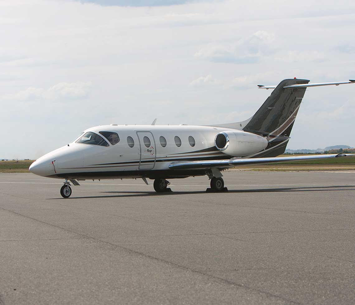 Nextant 400XT private jet charter on runway