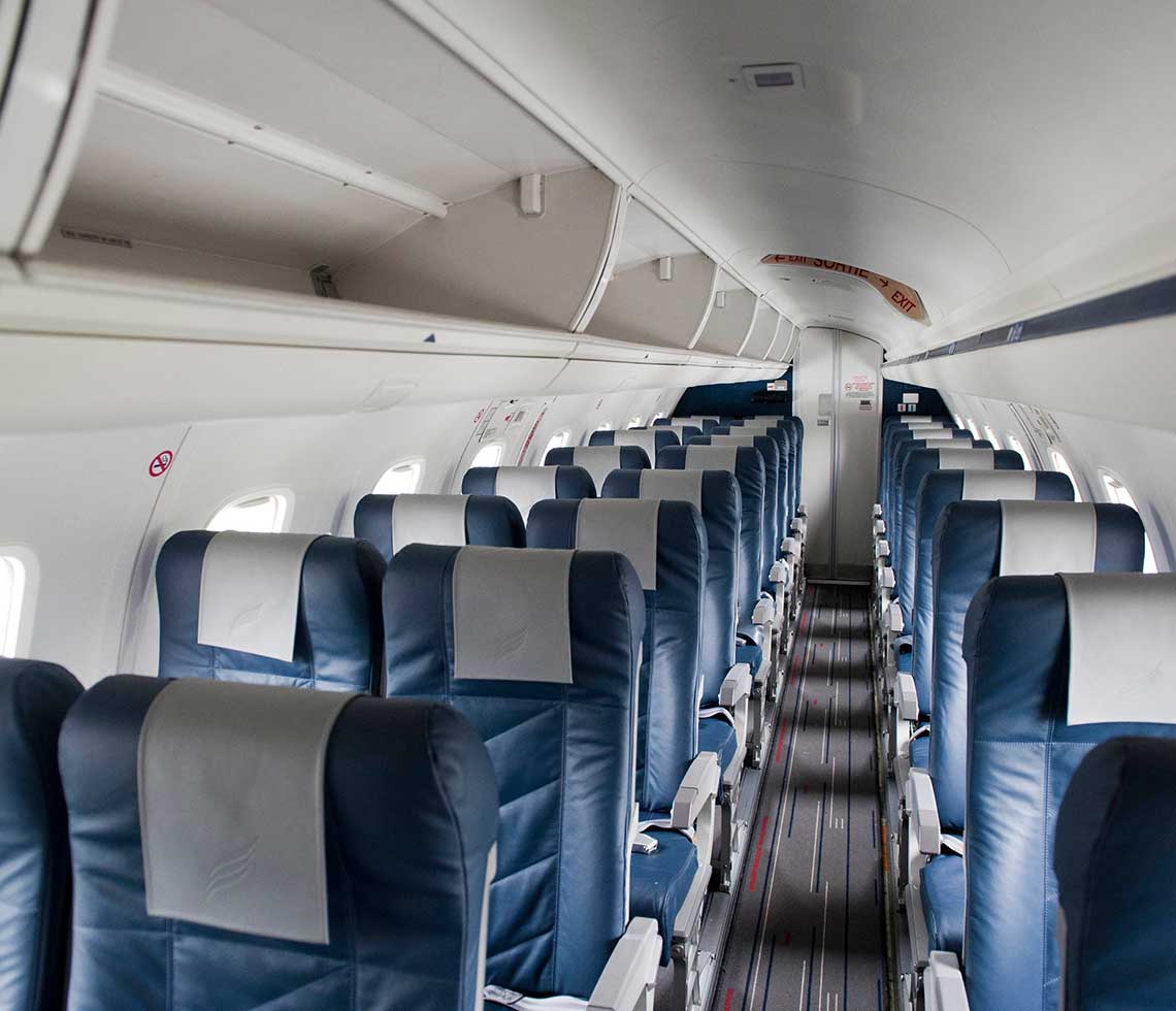 Embraer 145 Jet private aircraft interior with blue leather seats