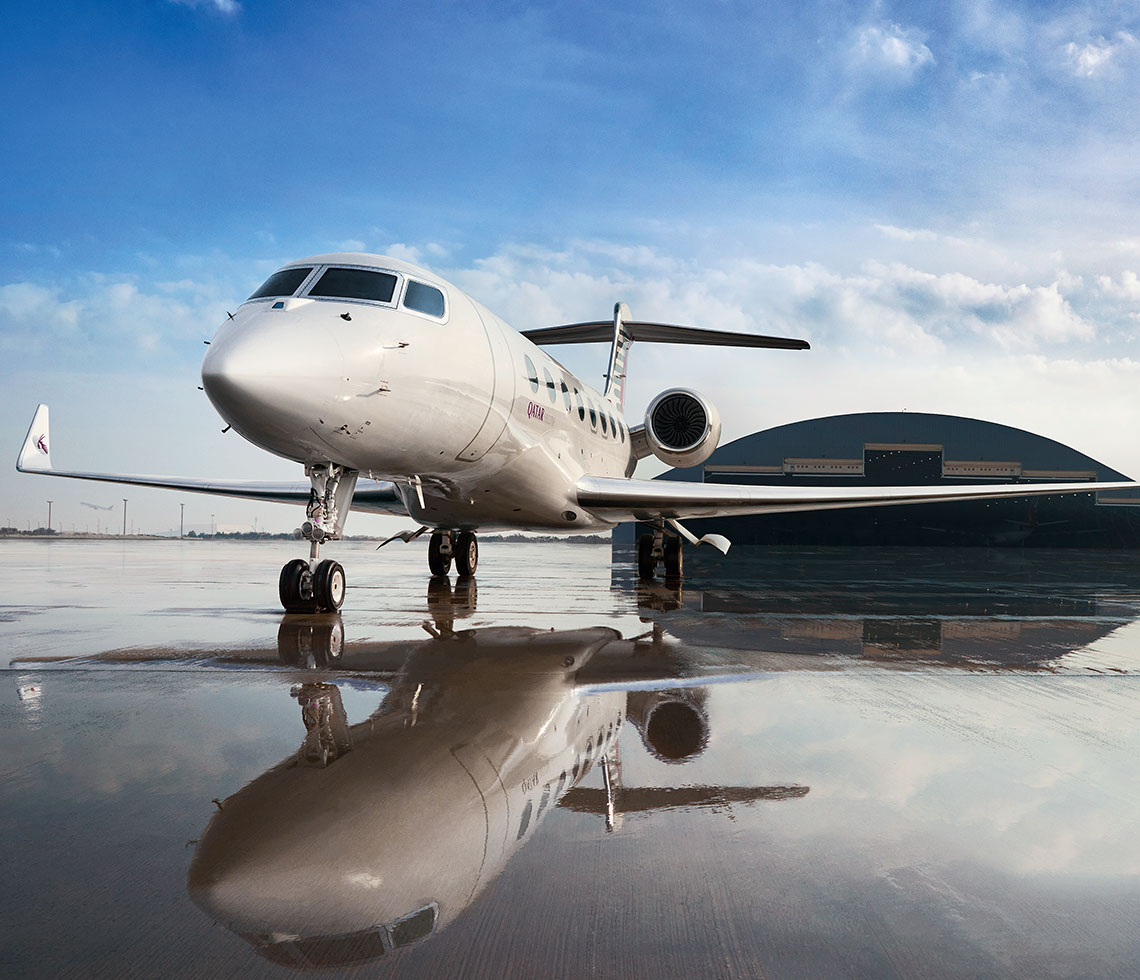 Gulfstream G650 private jet charter at airport hangar daytime