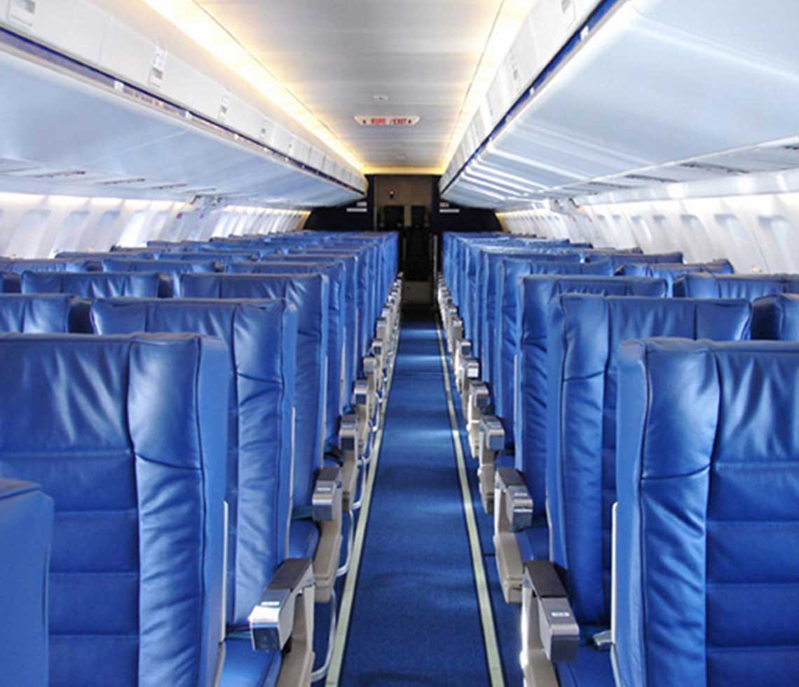 Fokker 100 private aircraft interior with blue seats