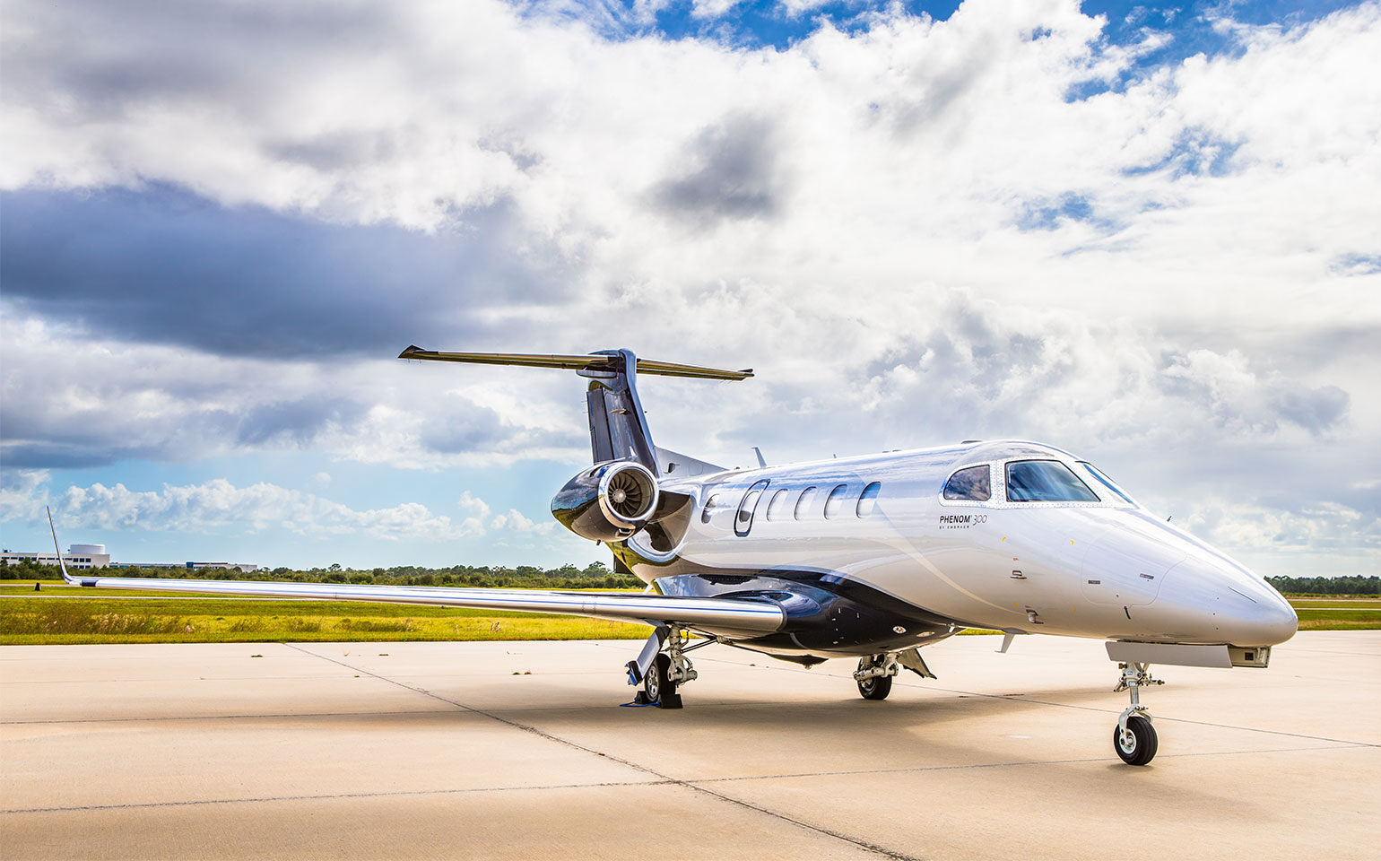 Embraer Phenom 300 private jet on runway